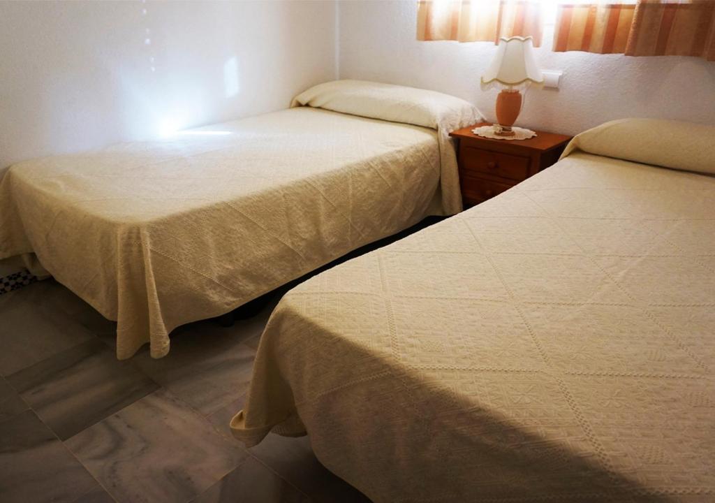 Postel nebo postele na pokoji v ubytování Los Pinos 4