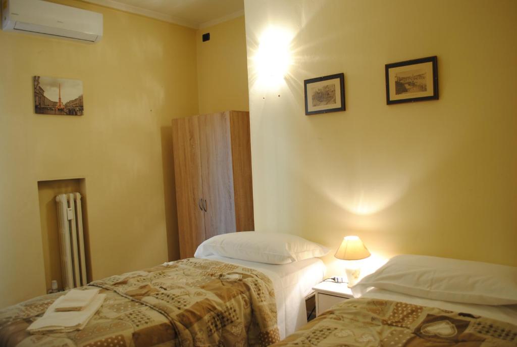Posteľ alebo postele v izbe v ubytovaní Dreaming Piazza Bra Rooms