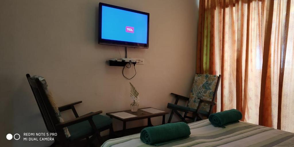 TV a/nebo společenská místnost v ubytování Hotel Bonanza