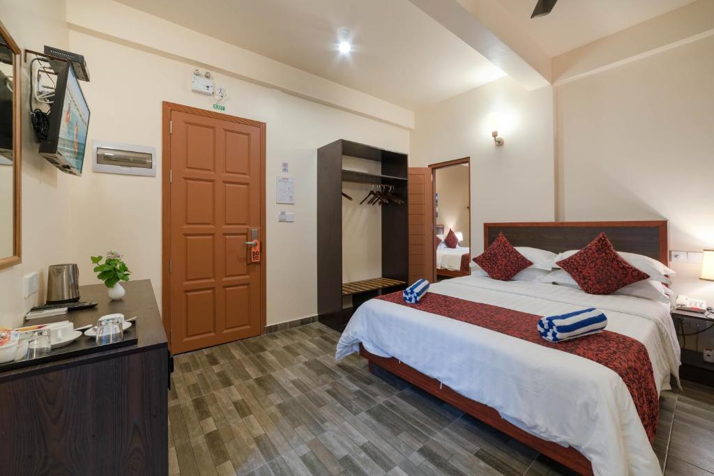 Postel nebo postele na pokoji v ubytování Paguro Beach Inn