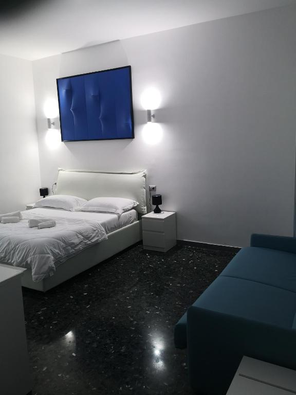 Łóżko lub łóżka w pokoju w obiekcie Dimore Pietrapenta Apartments, Suites & Rooms - Via Lucana 223, Via Piave 23, Via Chiancalata 16