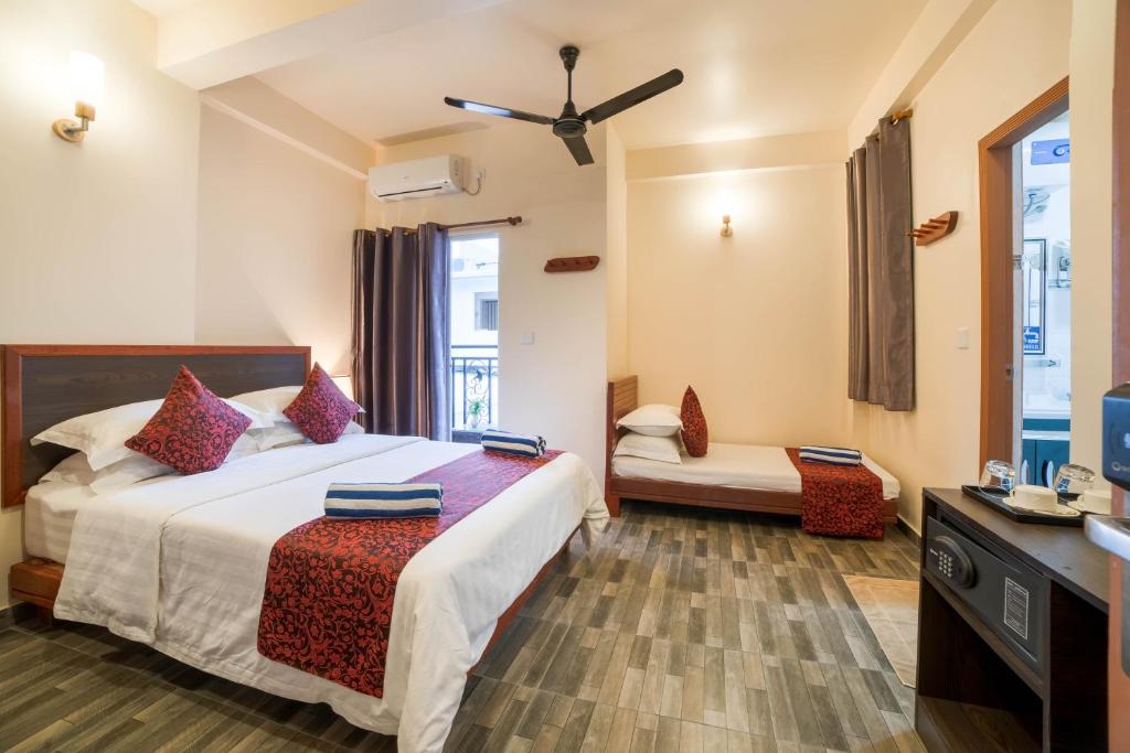 Postel nebo postele na pokoji v ubytování Paguro Beach Inn