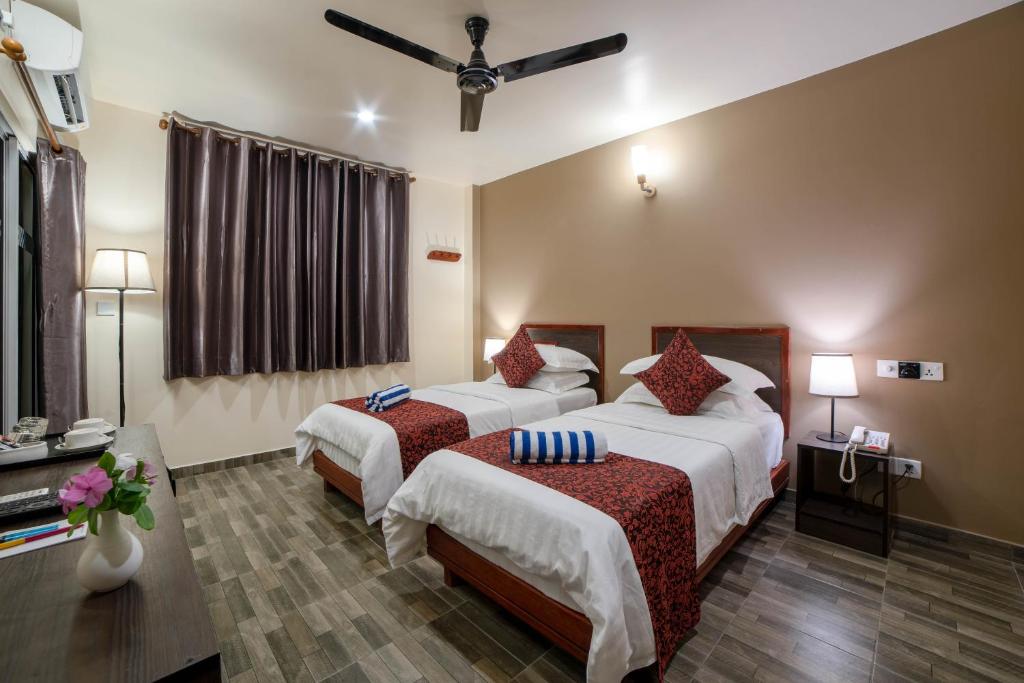 Postel nebo postele na pokoji v ubytování Paguro Beach Inn