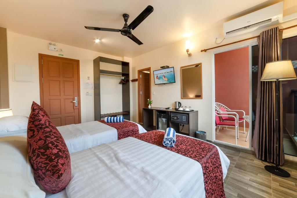 Postel nebo postele na pokoji v ubytování Paguro Beach Inn