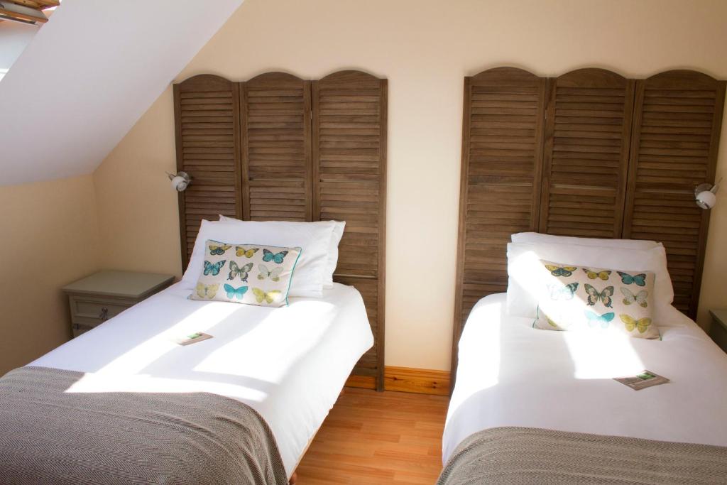 Postel nebo postele na pokoji v ubytování Madra Rua Organic Accommodation