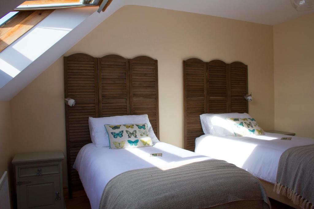 Postel nebo postele na pokoji v ubytování Madra Rua Organic Accommodation