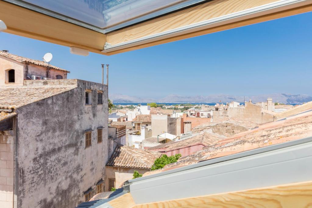 a view of the city from the window of a building at Fonda Llabres Boutique in Alcudia