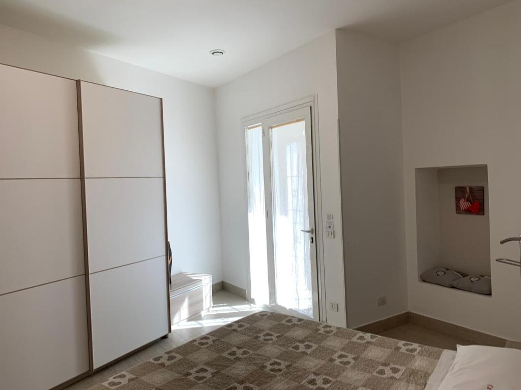 Łóżko lub łóżka w pokoju w obiekcie CA FOSCARI Apartments San Siro