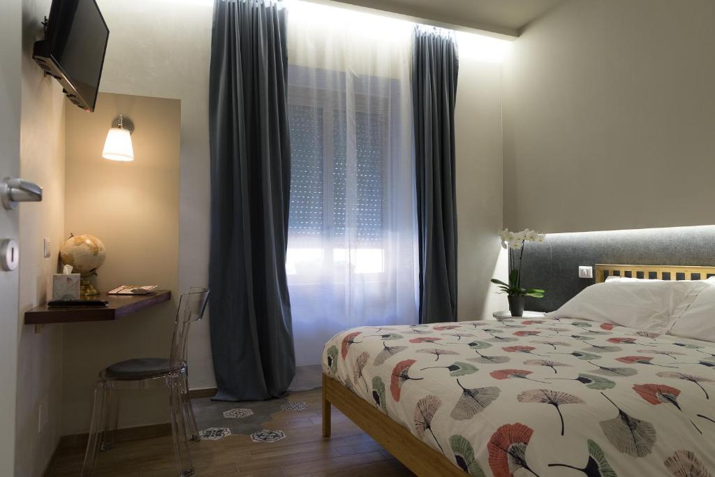 Ένα ή περισσότερα κρεβάτια σε δωμάτιο στο MiraMonti Rooms