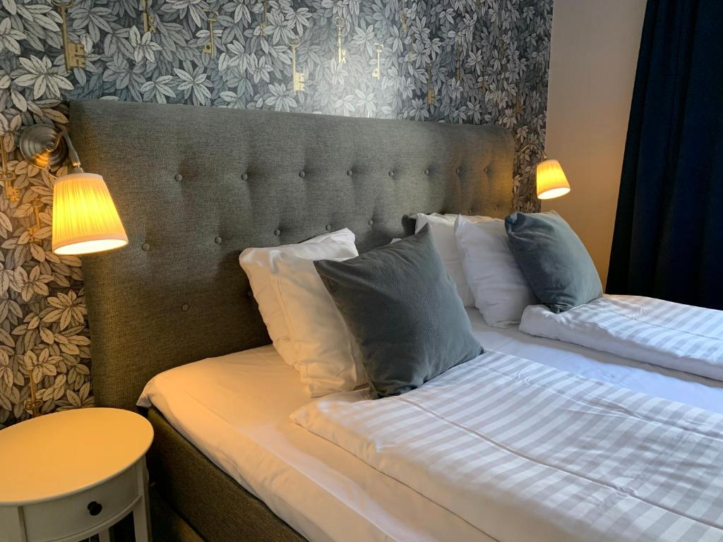 Postel nebo postele na pokoji v ubytování Hotel Wictoria