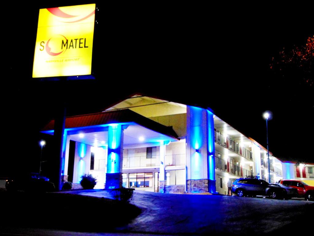 a building with blue lights in front of it at Somatel Nashville Airport in Nashville