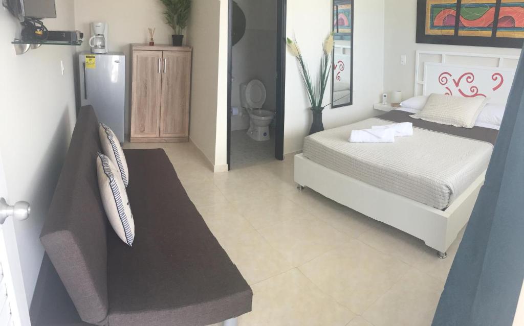 Postel nebo postele na pokoji v ubytování Caribbean Island Hotel