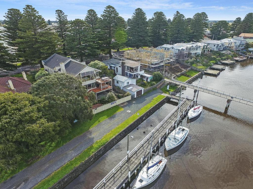 an aerial view of a marina with boats in the water at Shearwater Riverview Apartment in Port Fairy