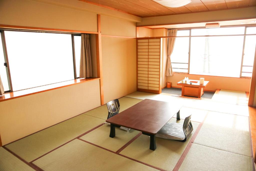 Postel nebo postele na pokoji v ubytování HOTEL&RESORT Izu no Ne
