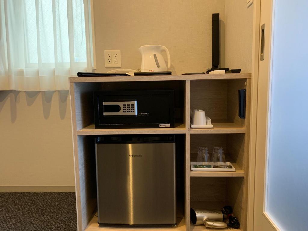 Kuchyň nebo kuchyňský kout v ubytování HOTEL STATE TENNOJI