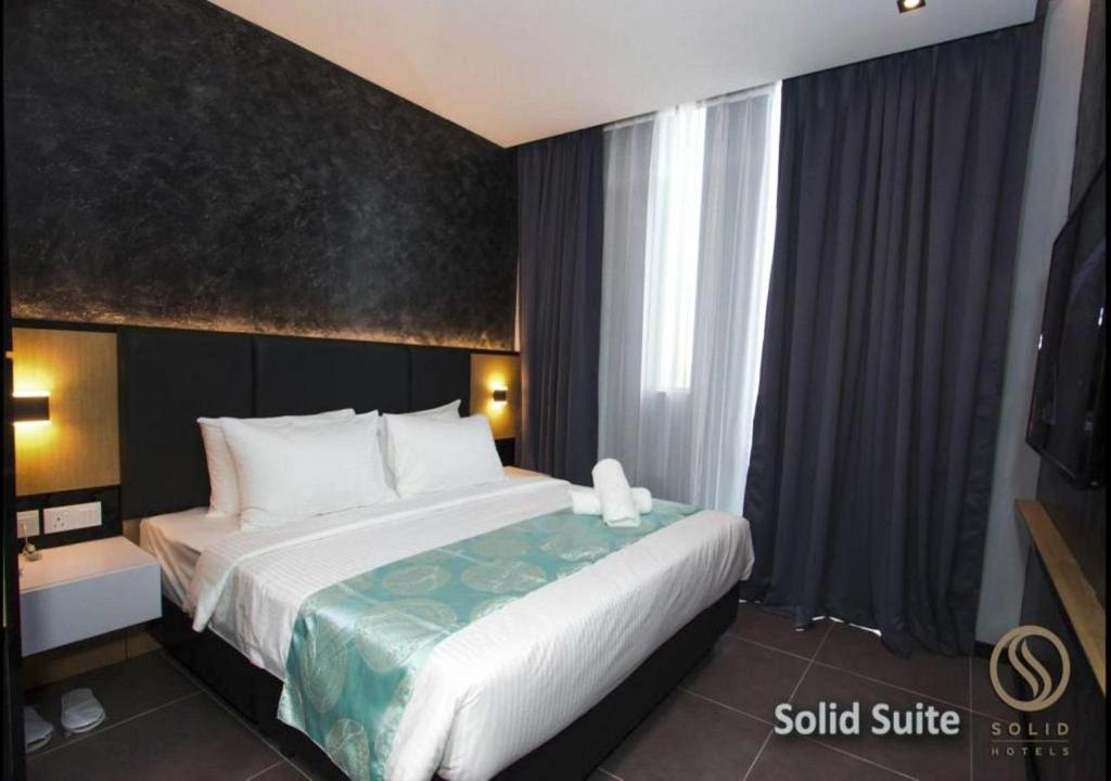 Postel nebo postele na pokoji v ubytování Solid Hotels