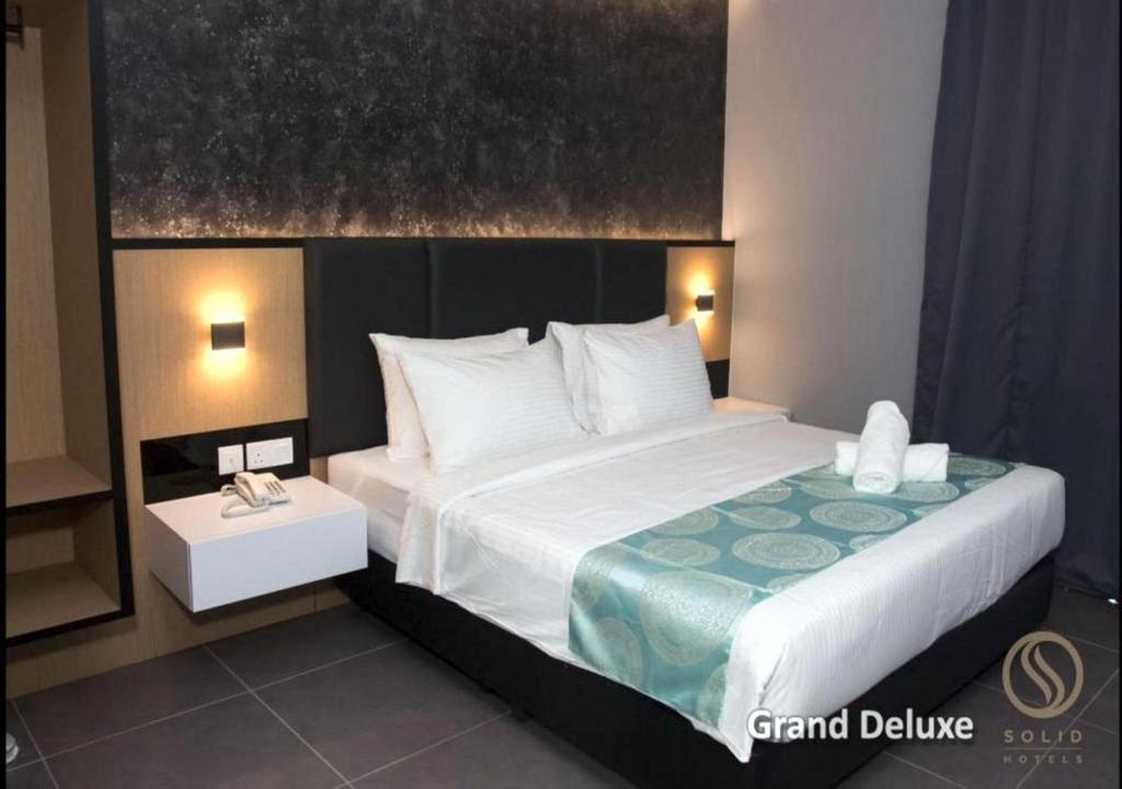 Postel nebo postele na pokoji v ubytování Solid Hotels