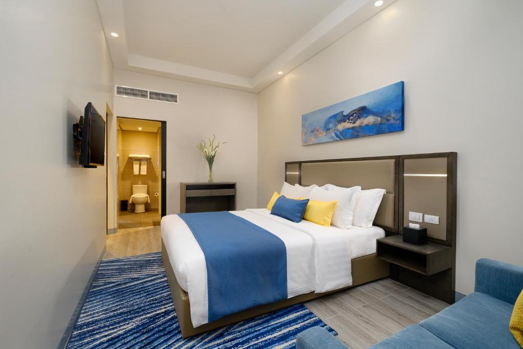 Uma cama ou camas num quarto em Savoy Hotel Mactan