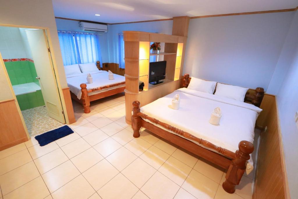 Postel nebo postele na pokoji v ubytování Chiang Rai Park Resort