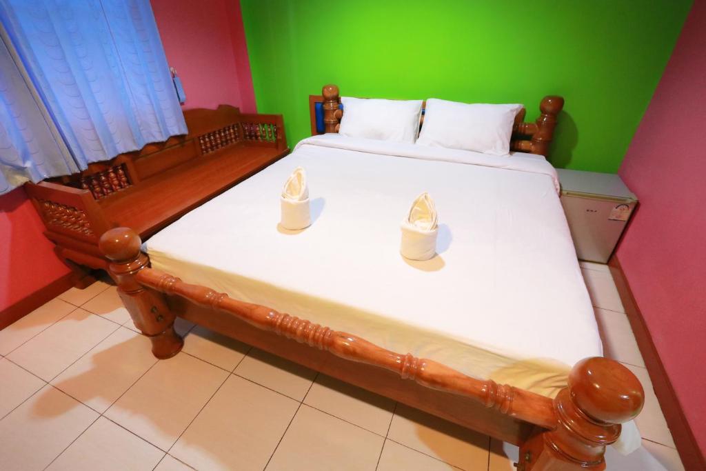 Postel nebo postele na pokoji v ubytování Chiang Rai Park Resort