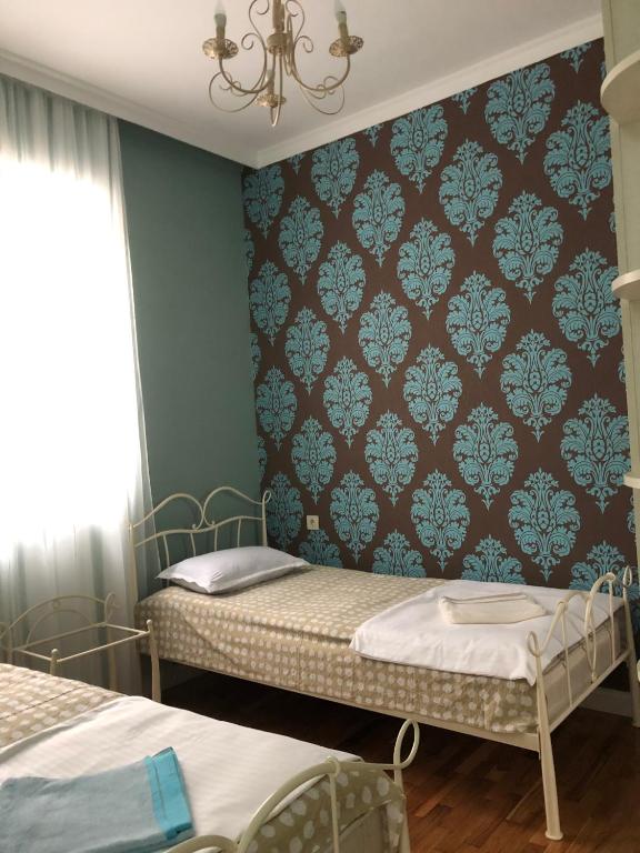 Postel nebo postele na pokoji v ubytování Villa NiNo