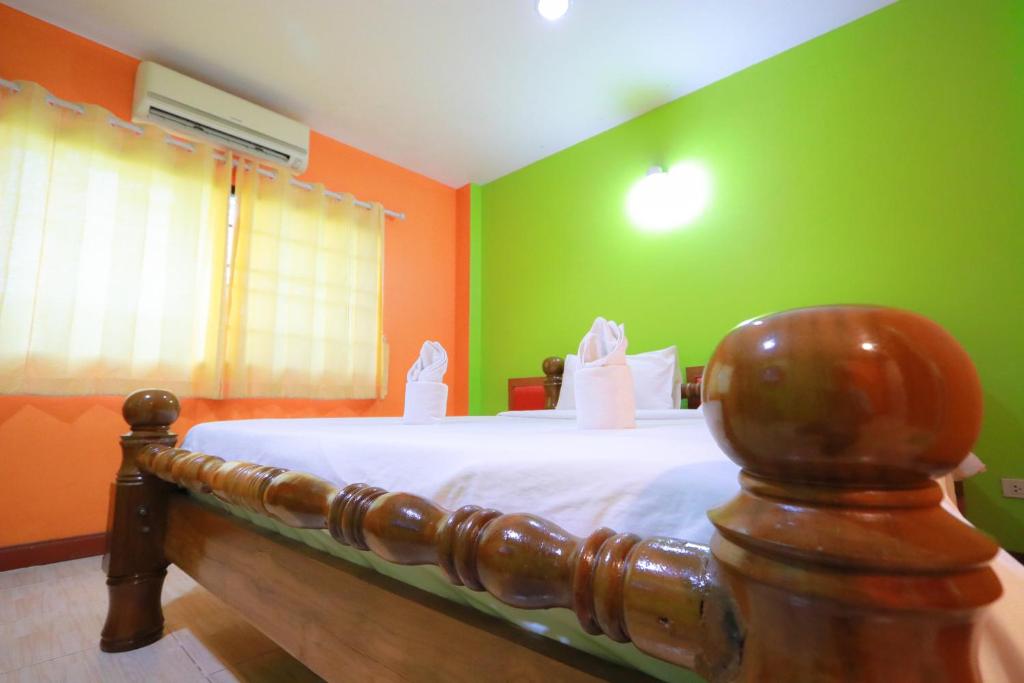 Postel nebo postele na pokoji v ubytování Chiang Rai Park Resort
