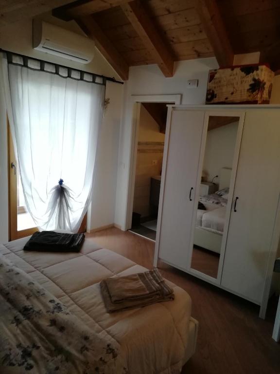 Postel nebo postele na pokoji v ubytování CastelCharme b&b