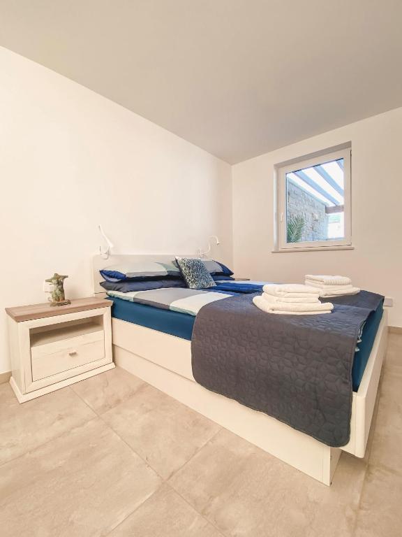 Postel nebo postele na pokoji v ubytování Salinea Apartments