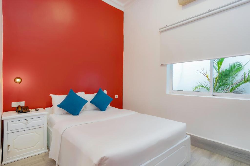 Postel nebo postele na pokoji v ubytování Glow Inn Siem Reap