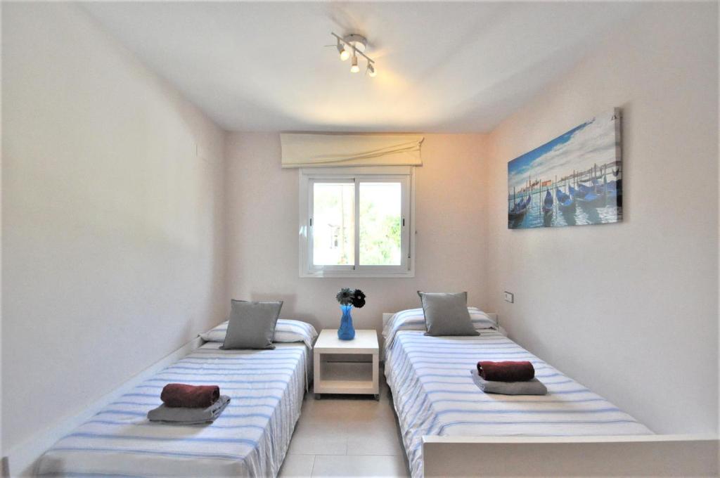 Postel nebo postele na pokoji v ubytování ES PAS- Chalet en Cala Pi muy solicitado