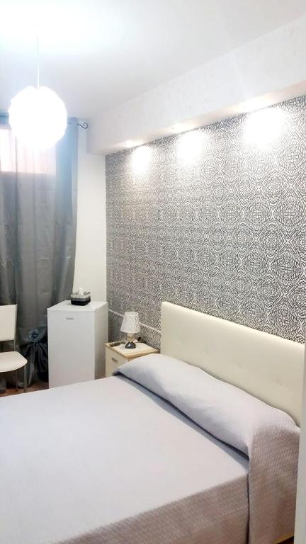 Łóżko lub łóżka w pokoju w obiekcie Guesthouse da Filiberto