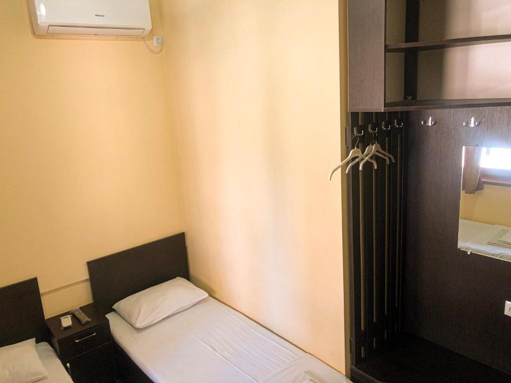 Postel nebo postele na pokoji v ubytování Hotel Victoria