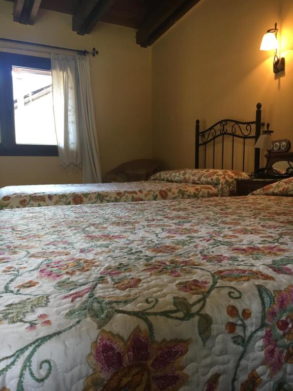 Postel nebo postele na pokoji v ubytování Casa Rural Era de Ferro