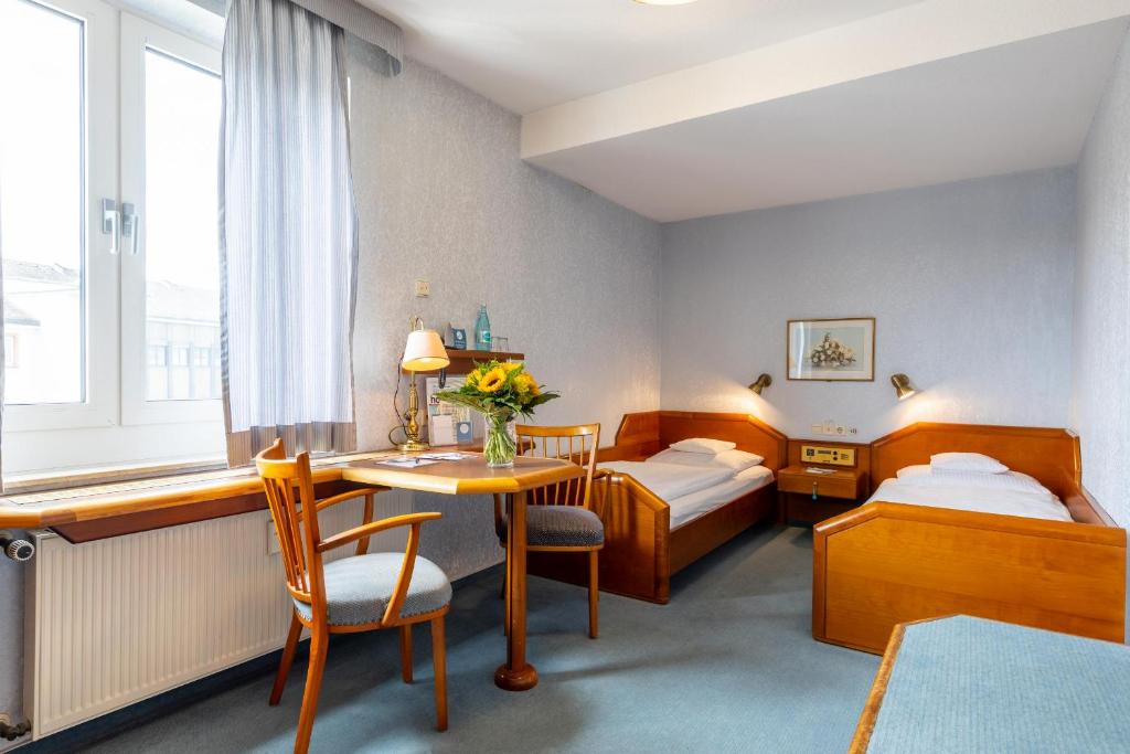 Postel nebo postele na pokoji v ubytování Trip Inn Aschaffenburger Hof