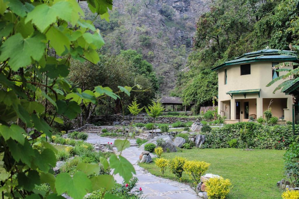 a garden in front of a house at Soulitude by the Riverside in Nainital