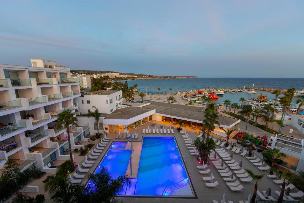 an overhead view of a resort with a swimming pool at Limanaki Beach Hotel & Suites in Ayia Napa