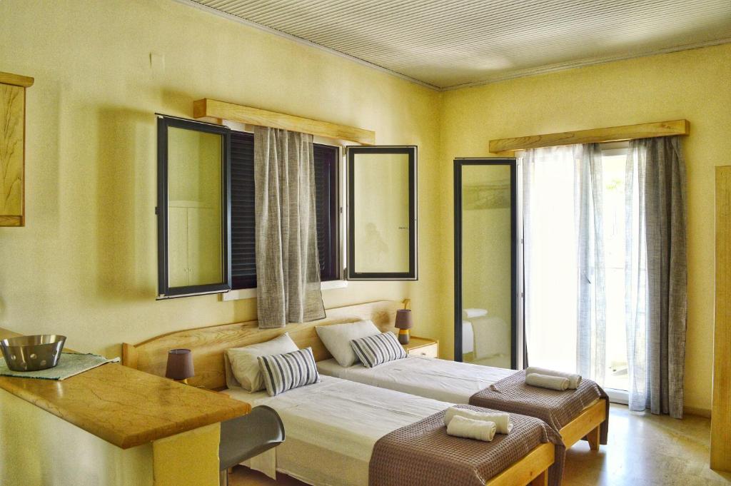 Postel nebo postele na pokoji v ubytování SunRose Beach Aparthotel