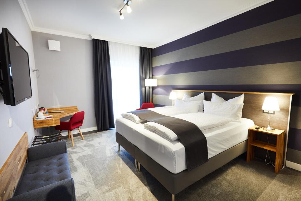 Hotel Garni am Schloss tesisinde bir odada yatak veya yataklar