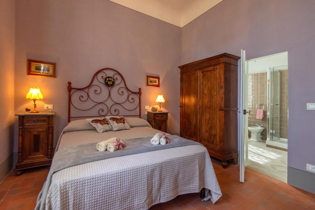 Posteľ alebo postele v izbe v ubytovaní Agriturismo Villa Ulivello in Chianti