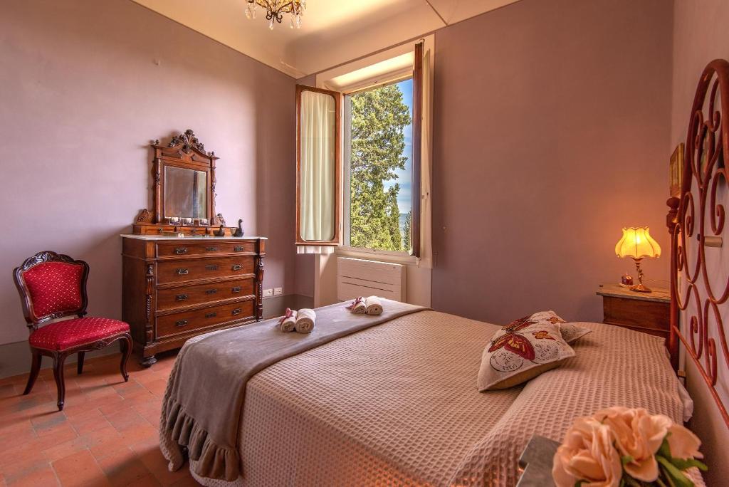Posteľ alebo postele v izbe v ubytovaní Agriturismo Villa Ulivello in Chianti