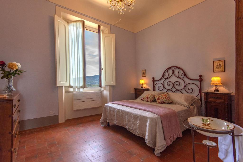 Posteľ alebo postele v izbe v ubytovaní Agriturismo Villa Ulivello in Chianti