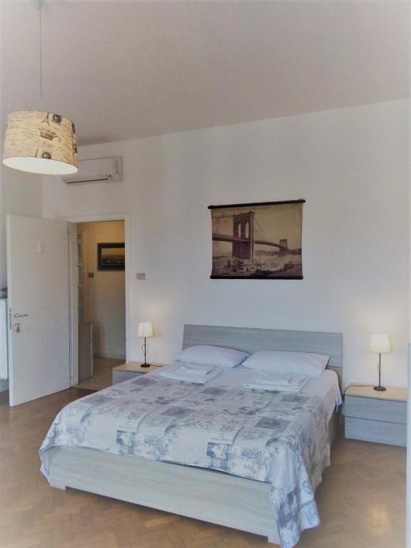 Postel nebo postele na pokoji v ubytování Dreaming Verona Rooms