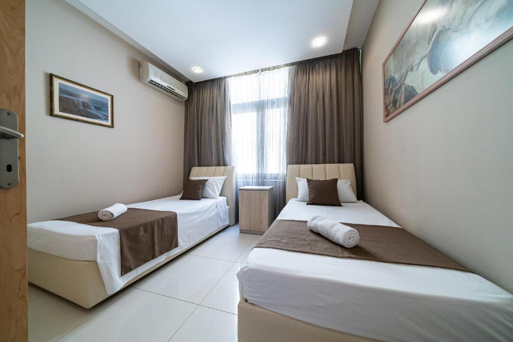 Postel nebo postele na pokoji v ubytování Marsalforn Apartment Del Mar