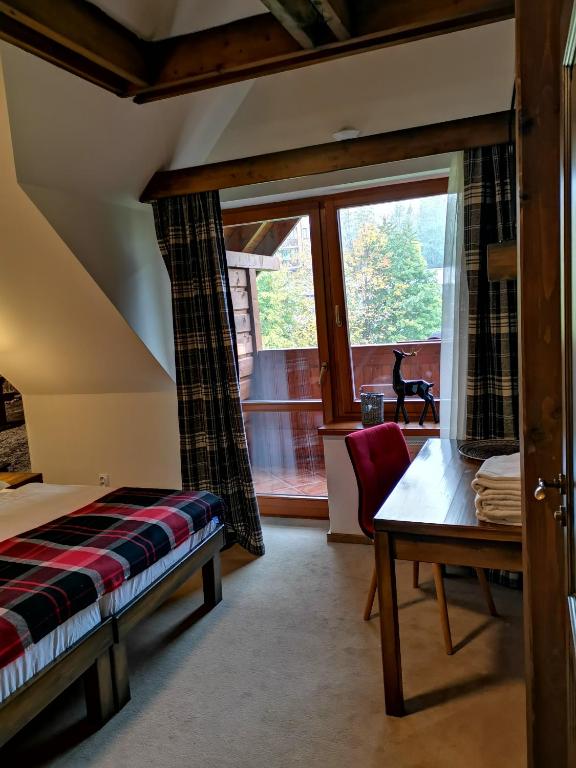Postel nebo postele na pokoji v ubytování Family apartment in Tatranska Lomnica