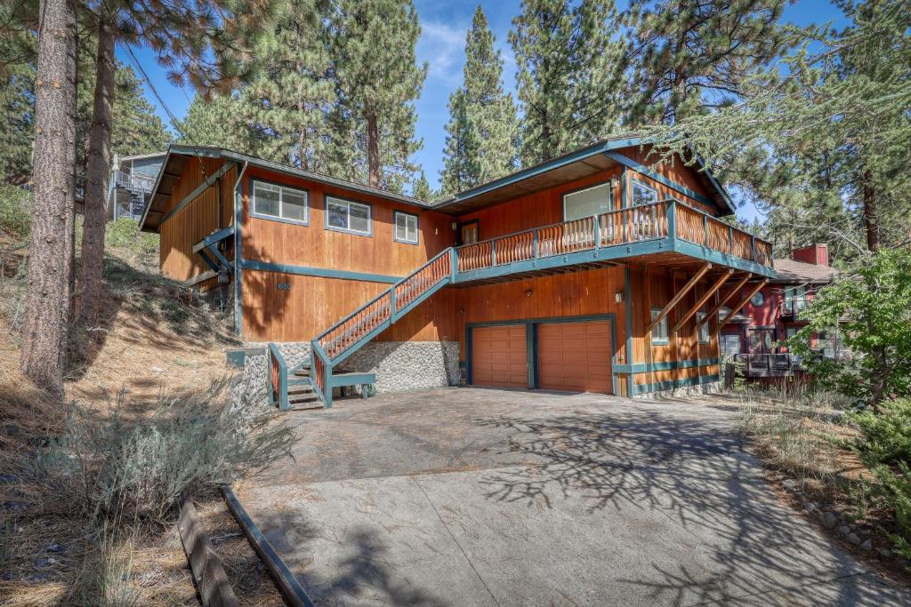 a house in the woods with a large driveway at Cascading Canyon in Zephyr Cove