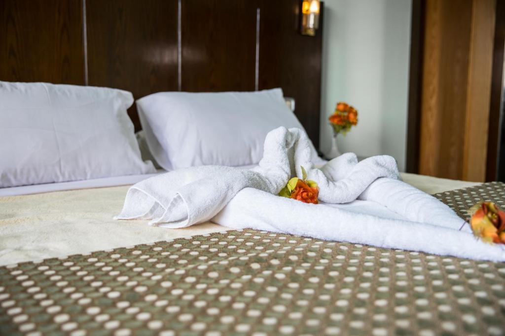 Postel nebo postele na pokoji v ubytování Aura Inn Hotel Cairo