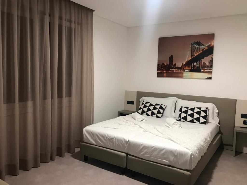Postel nebo postele na pokoji v ubytování Albergo RISTORANTE SOTTOCASTELLO