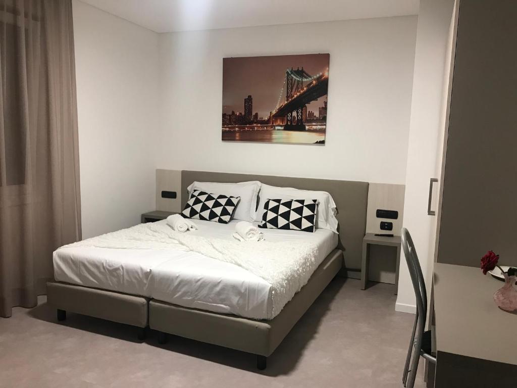 Postel nebo postele na pokoji v ubytování Albergo RISTORANTE SOTTOCASTELLO