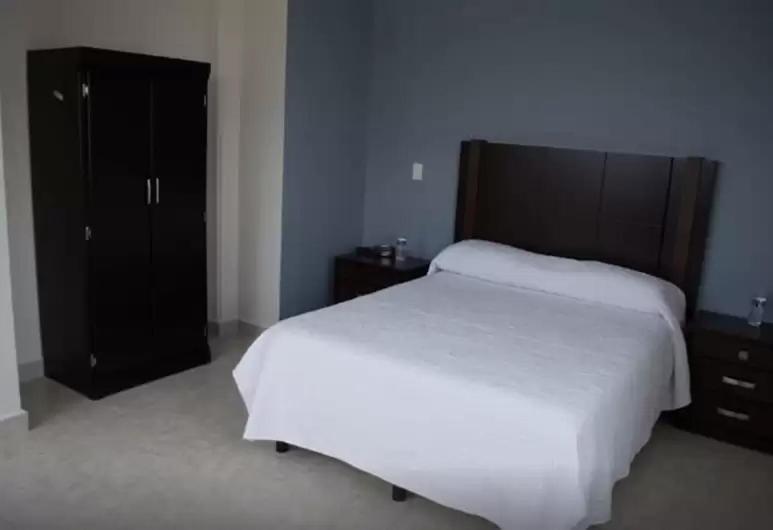 Postel nebo postele na pokoji v ubytování HOTEL CANDELERO