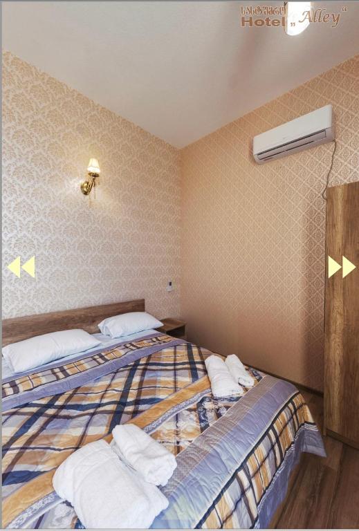 Postel nebo postele na pokoji v ubytování Hotel Alley
